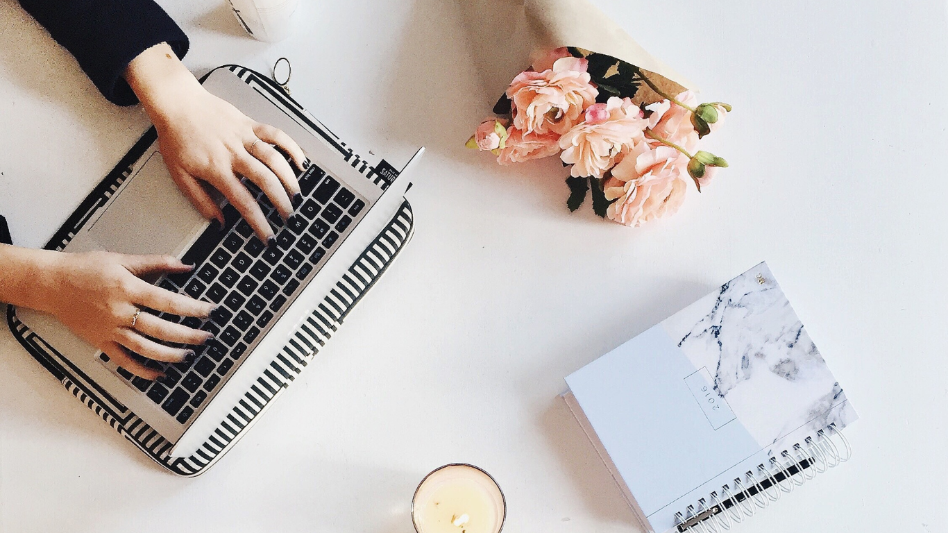 Woman smiling with raised upturned hands