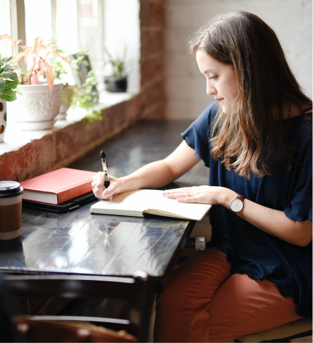 Woman smiling with raised upturned hands